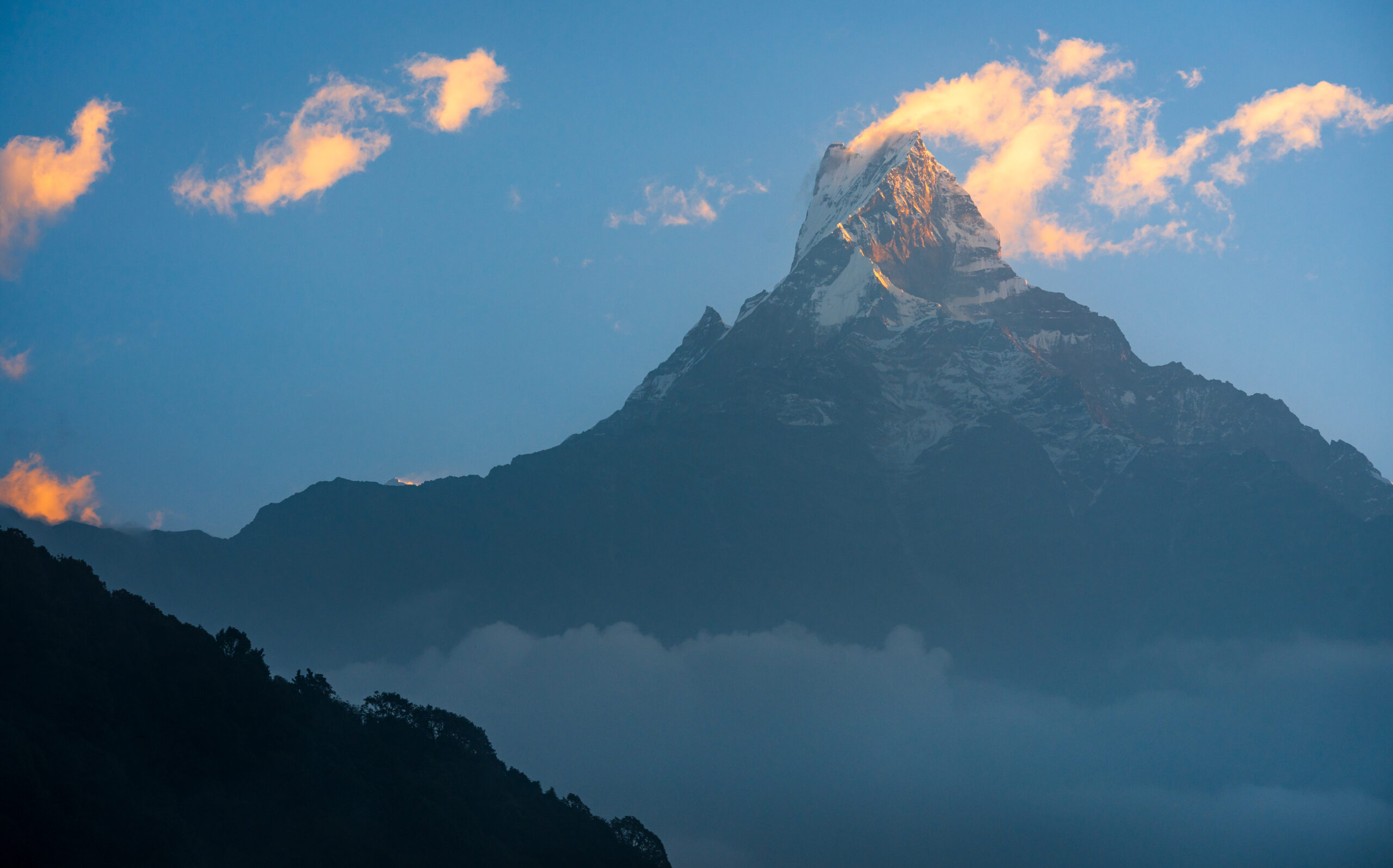 Summit of Machhapuchhre mountain seen on the trail to Mardi Himal Base Camp in Annapurna Region of Nepal.