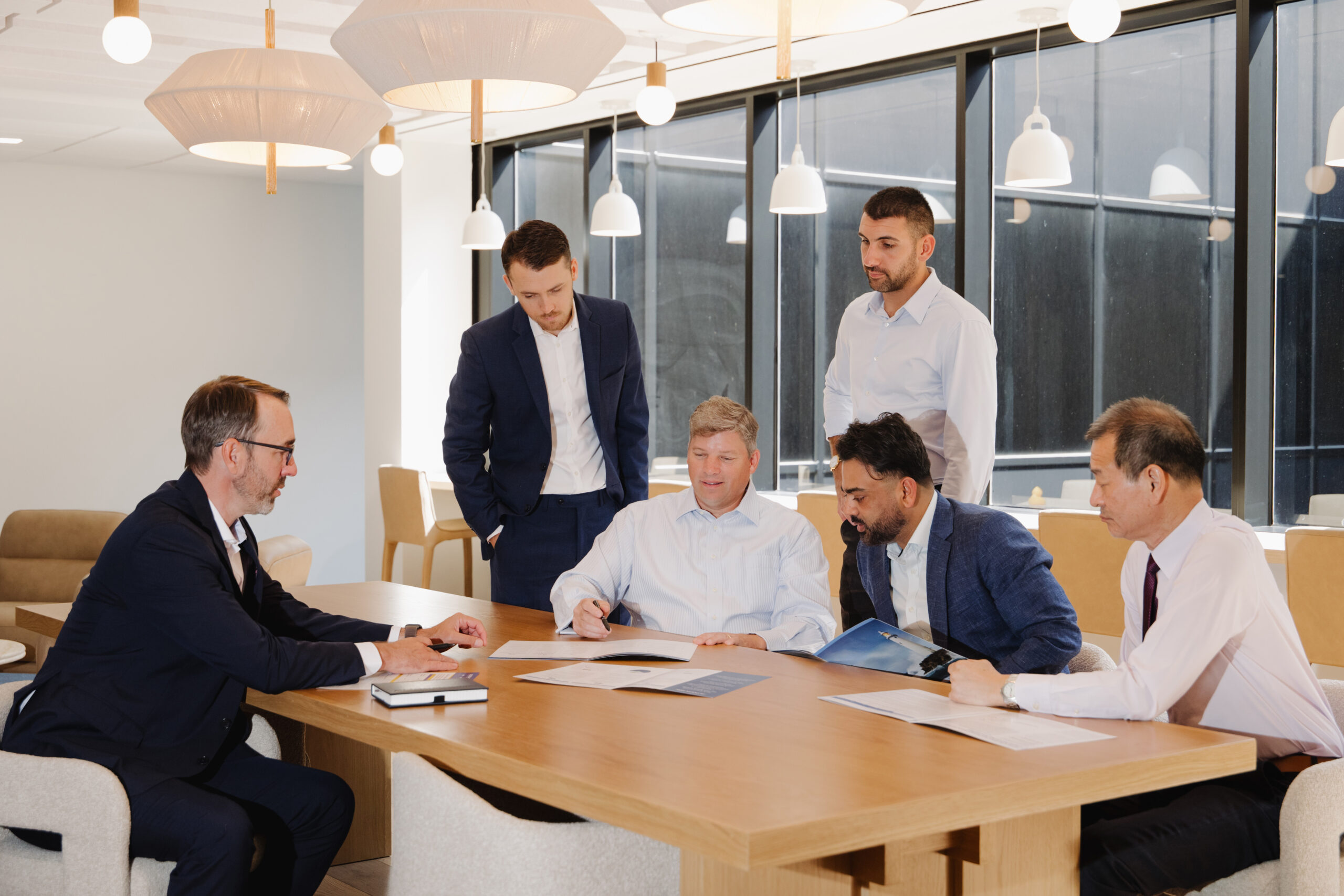 SIM Investment Team around table