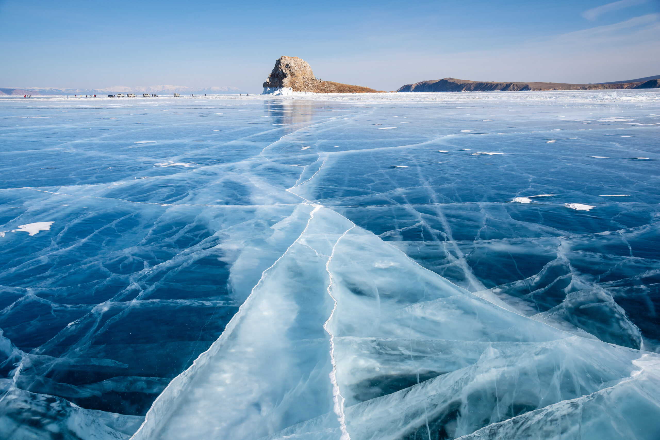 Baikal lake in winter day. Cracks on surface of the natural ice